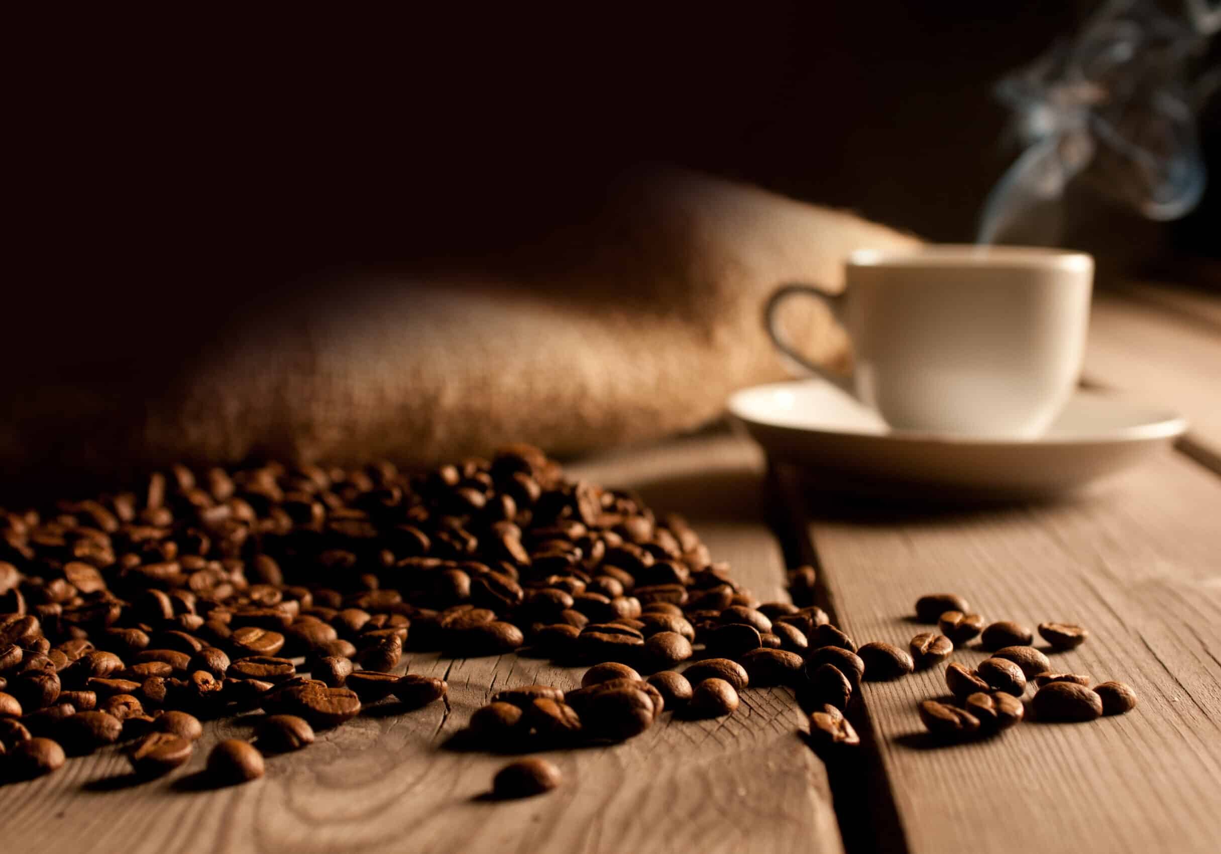 Coffee,Background,With,Beans,And,White,Cup.,Dark,Atmosphere,And